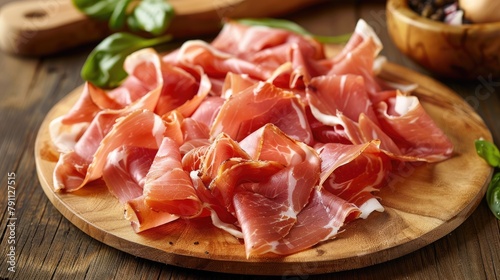 Parma ham slices on a wooden platter