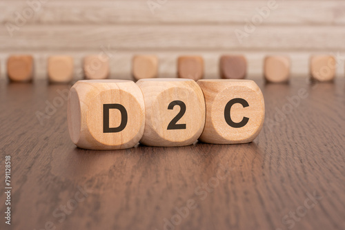 wooden cubes with the letters d2c on them photo