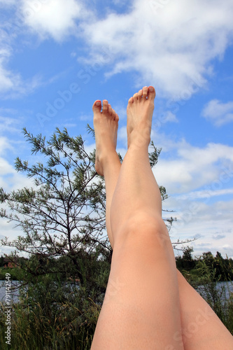 women's feet on the beach