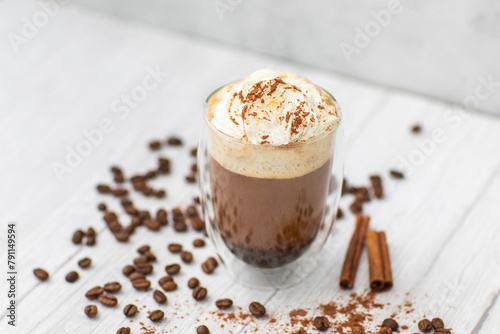 Fototapeta Naklejka Na Ścianę i Meble -  Coffe drink drink with black coffee, whipped cream, cocoa, chocolate on a light wooden table.  