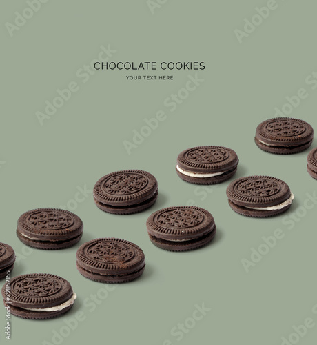 Creative layout made of chocolate cookies on the green background. Food concept. Macro concept. (ID: 791152155)