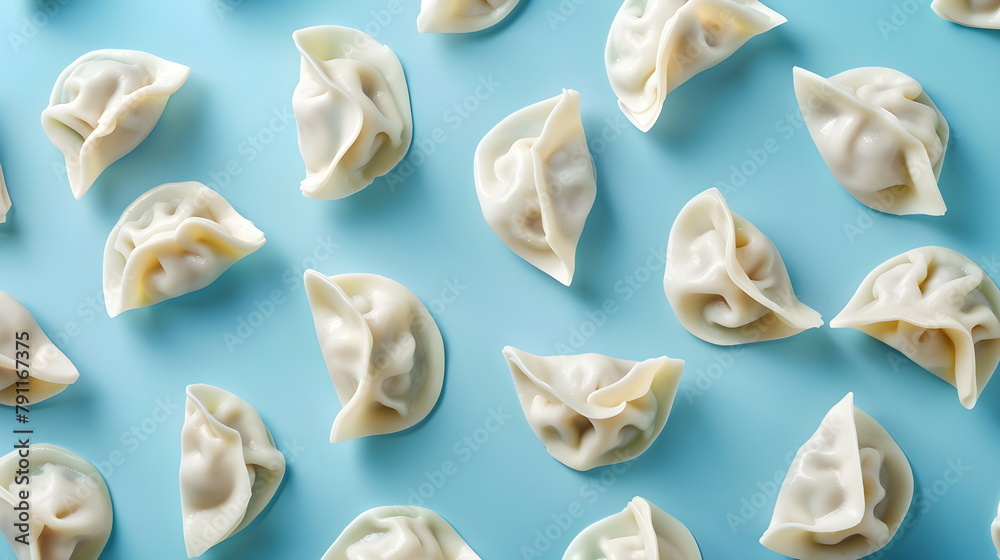 Dumplings isolated on a light blue background. Dumplings, dumplings, dumplings, filled pies. Modeling, photo above Dumplings isolated on a light blue background. Dumplings, dumplings, dumplings, filled pies. Modeling, photo above