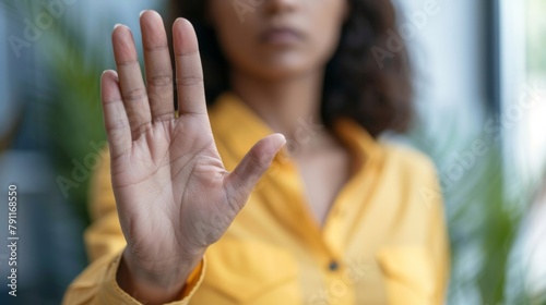 Closeup of a person setting boundaries and saying no to a request using their emotional intelligence to recognize their limits and prioritize their wellbeing in both personal and professional . photo