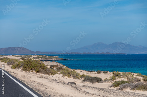 Caleta del bajo, corralejo grandes playas white sandy beach with blue water near Corralejo touristic town on north of Fuerteventura, Canary islands, Spain