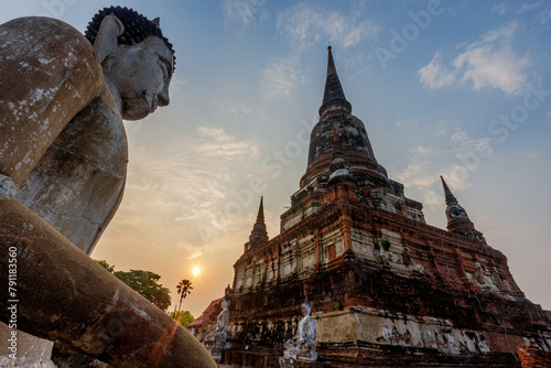 The background of important religious attractions, Wat Yai Chai Mongkhon, has an old Buddha statue and a large pagoda for tourists to study the history of Ayutthaya in Thailand. photo