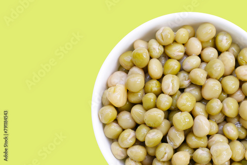 Canned green peas on white background.