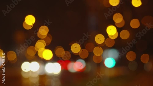 Twilight Rainy Urban scene. Cityscape lights bokeh, Car Trails, Traffic at dask city, Night Drive photo