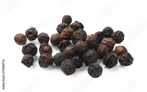 Aromatic spice. Many black dry peppercorns isolated on white