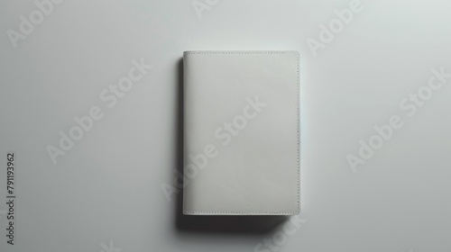 Minimalist white blank mockup of a passport holder with embossed detail . photo