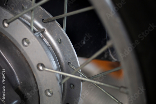 Motorcycle wheel close up. Selective focus on front wheel.