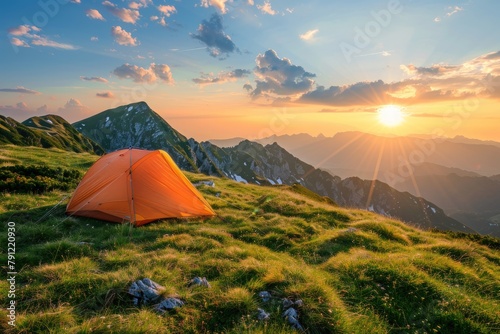 Beautiful sunrise over the mountains with orange tents. Generate AI image