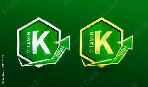 High vitamin K in hexagon shape aluminum gold and silver with shine arrow. Used for design nutrition supplement products. Vitamins label symbol logo 3D on green background. Vector EPS10.
