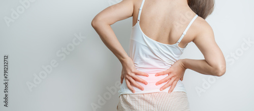 woman having back body ache during at home. adult female with muscle pain due to Piriformis Syndrome, Low Back Pain and Spinal Compression. Office syndrome and medical concept © Jo Panuwat D