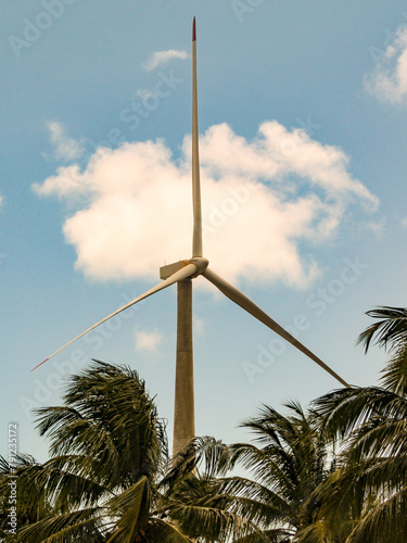 Wind turbine, with the blue sky in the background. photo