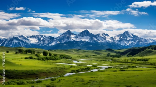 Panoramic view of Mongolian steppe and snow-capped mountains