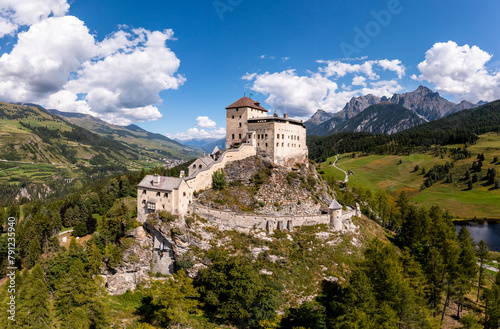 Aerial view of the famous Tarasp castle near Scuol in the alps in Canton Graubunden in Switzerland on a sunny summer day.