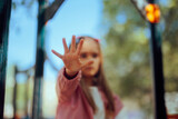 Child with Dirty Hands Saying Strop at the Playground. Kid playing outdoors having germs and bacteria on her dirty hands
