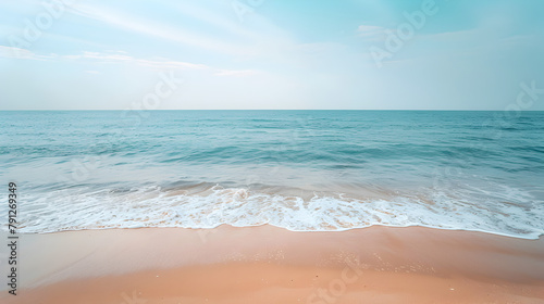 Beautiful scenery of morning sandy beach and turquoise ocean foamy waves