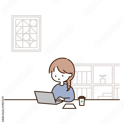 部屋でパソコン作業をする若い女性