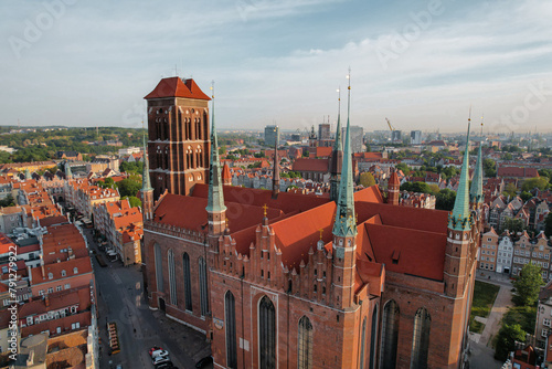 St. Mary's Basilica Beautiful panoramic architecture of old town in Gdansk, Poland at sunrise. Aerial view drone pov. Small vintage historical buildings Europe Tourist Attractions travel destination