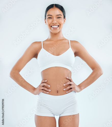 Woman, portrait and underwear with smile in studio or beaut, weight loss or white background. Female person, model and happiness with skincare confidence for self care wellness, fitness or exercise © peopleimages.com