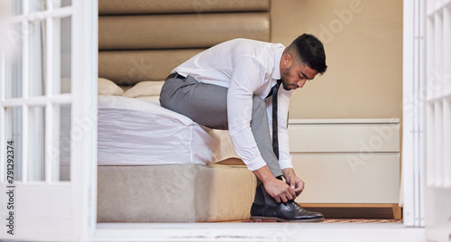 Businessman, tie laces and getting ready in home, consultant and employee dressing for work. Male person, professional and prepare shoes or footwear, fashion and formal clothing style in bedroom