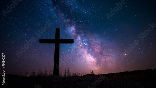 A cross is standing in a field of stars