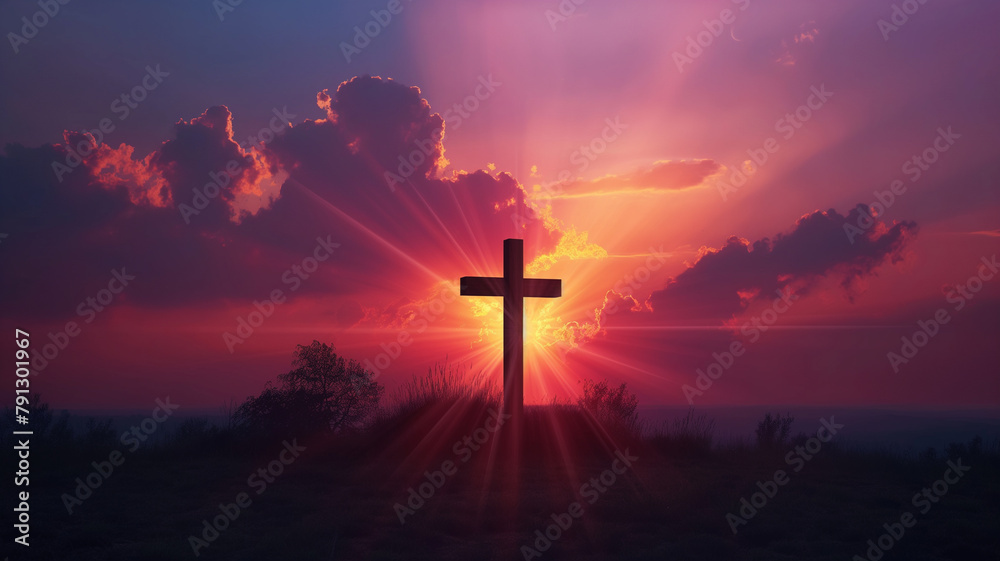 A cross is lit up in the sky with a sunset in the background
