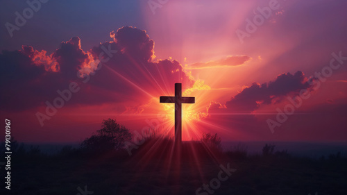 A cross is lit up in the sky with a sunset in the background © CtrlN