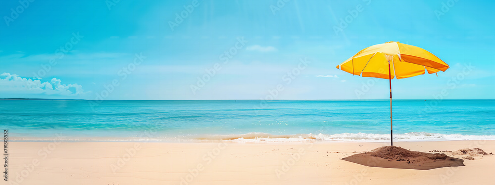 A yellow beach umbrella offers shade on a sunny beach day, perfect for wallpaper background or banner backdrop, empty space or copyspace editable