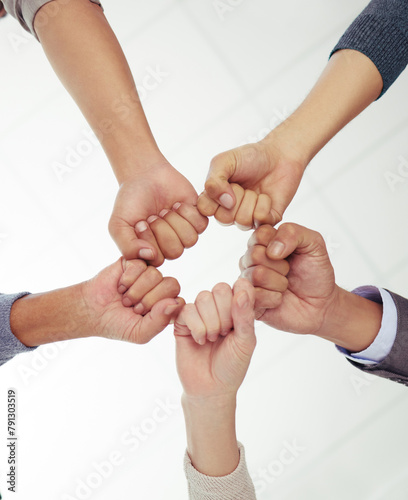 Business, people and fist or hands for teamwork, collaboration and unity for power with diversity and motivation. Group, community and together for support for project or task success and partnership