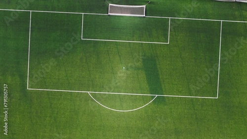 The penalty area on the soccer field, aerial view. Green background. photo