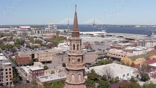 Aerial rising close-up shot of the spire atop Saint Philip's Church in Charleston, South Carolina. 4K photo