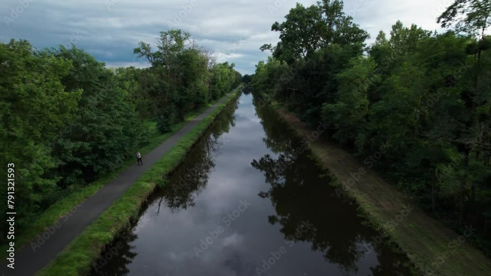 drone shot going backward revealing Roanne Digoin canal in Loire ad Saone et Loire Department, french countryside, auverge rhone alpes region drone shot going backward revealing Roanne Digoin canal in Loire ad Saone et Loire Department, french countryside, auverge rhone alpes region