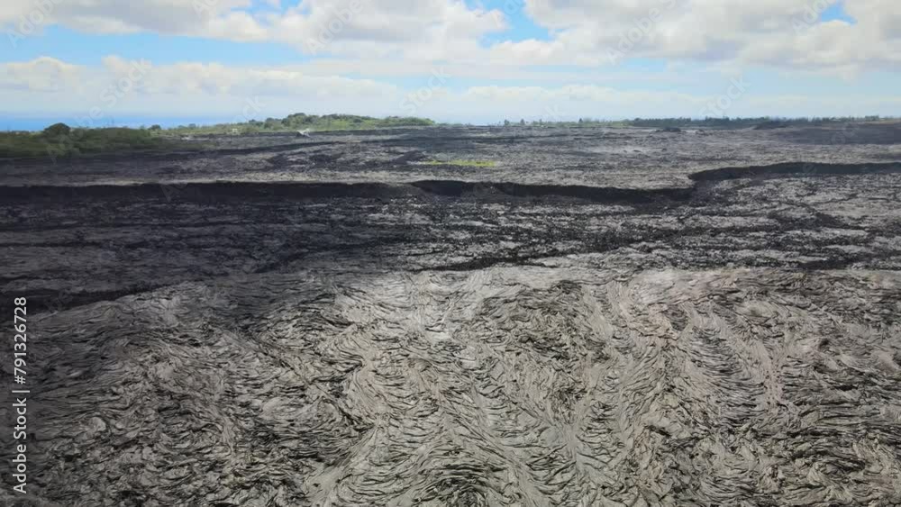 Drone pans, revealing vast scale of lava fields on Big Island, Hawaii, from Leilani Estates