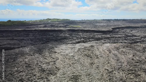 Drone pans, revealing vast scale of lava fields on Big Island, Hawaii, from Leilani Estates photo