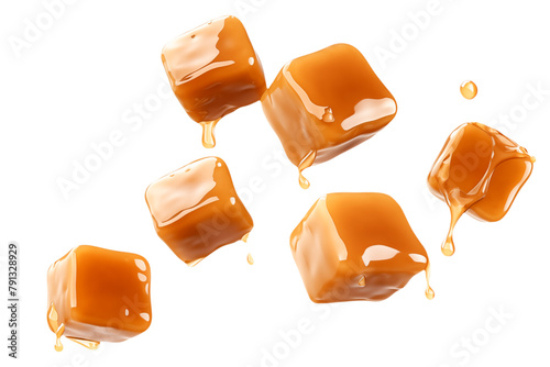 Salted caramel cubes levitation isolated on transparent background. photo