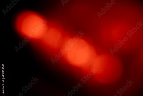 Blurred Red lights abstract background. Defocused glittering lights. Colorful wallpaper for design