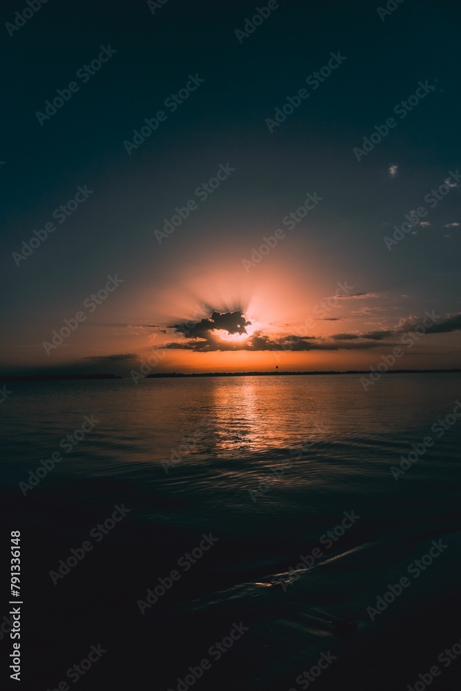 Scenic view of a beautiful sunset on the ocean horizon Scenic view of a beautiful sunset on the ocean horizon