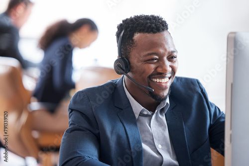 Happy man, computer and headphones in call center for customer service, consulting and operator. Male person, smile and headset at desk for telemarketing, sales support and client communication