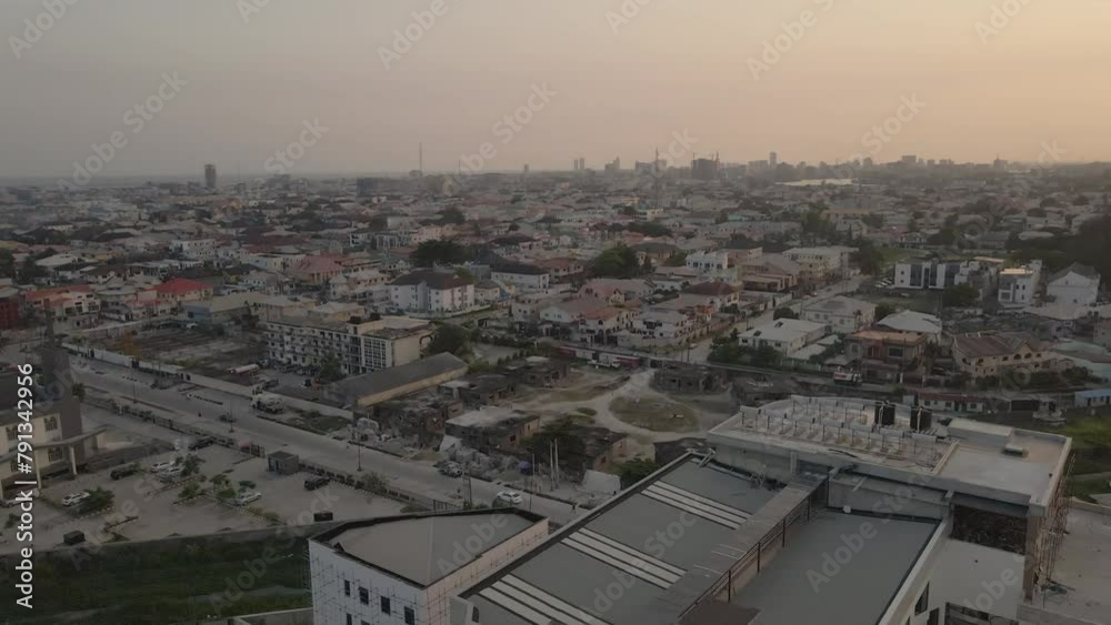 Drone pans right to reveal sunset over Lagos, Nigeria Drone pans right to reveal sunset over Lagos, Nigeria