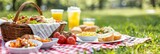 Picnic basket brimming with scrumptious dishes on lush park grass for a delightful outdoor feast