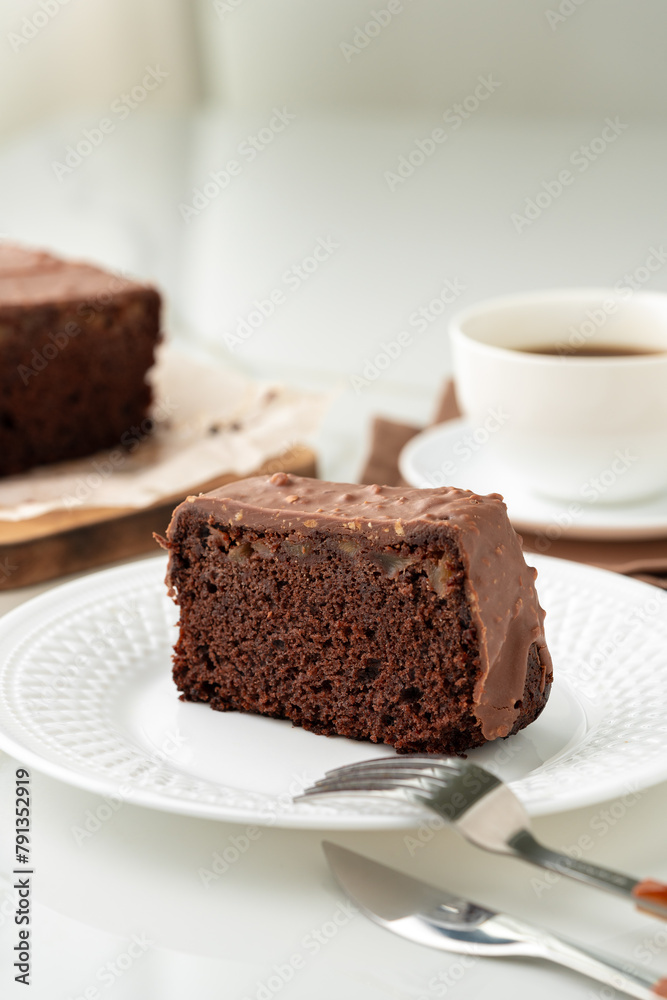 Fresh homemade chocolate sponge cake on wooden board Fresh homemade chocolate sponge cake on wooden board
