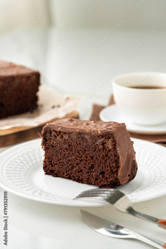 Fresh homemade chocolate sponge cake on wooden board