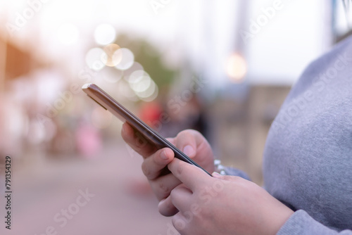 Women using smart phone mobile on soft background