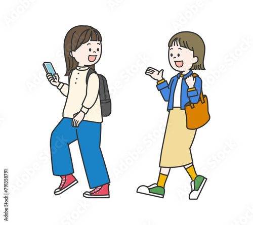 おしゃべりをしながら歩く女性たち