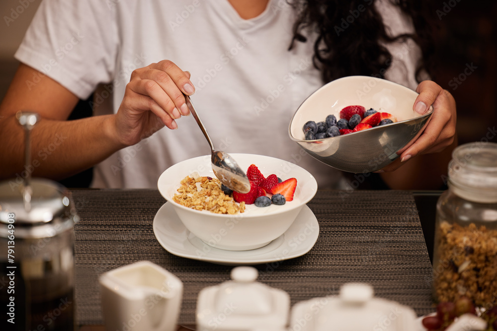 Breakfast, hands and yogurt in a home with woman with brunch serving of cereal and fruit. Health, nutrition and diet brunch with bowl for eating healthy for weight loss in the morning with food