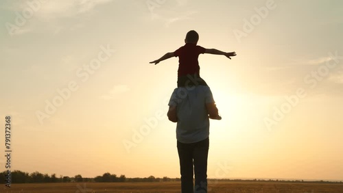 silhouette father carrying child boy his shoulders sunsethappy family, family outdoor activity, child piggyback father, bonding family silhouette., father and son play, childhood adventure piggyback photo