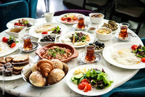 Table With Various Plates of Food