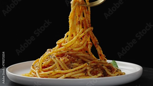Traditional pasta spaghetti in plate on table.